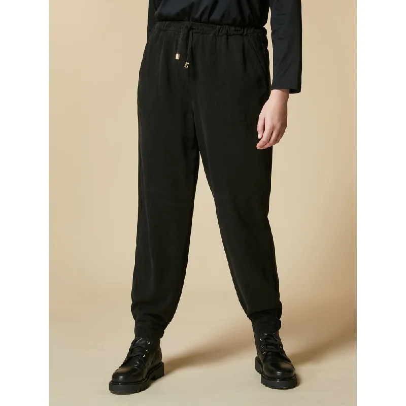 Fashion-forward tight trousers for women with metallic sheen and edgy design -RADIALE