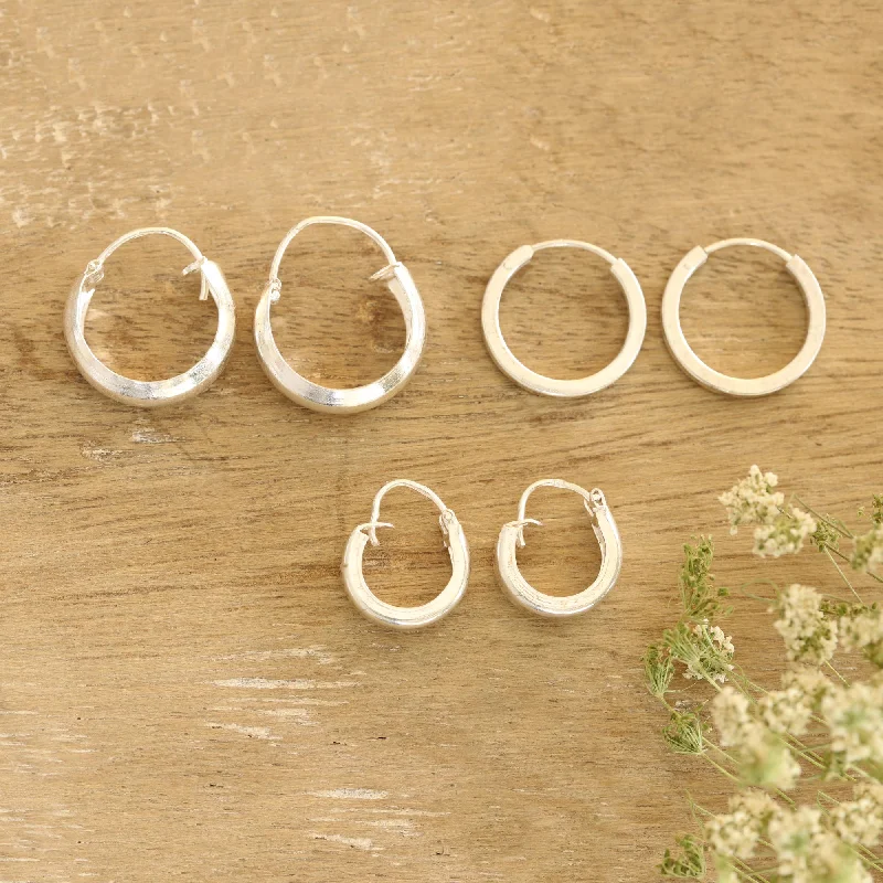 Hoop earrings with open designs for a modern, lighthearted vibe-Lustrous Loops Artisan Crafted Sterling Silver Hoop Earrings (Set of 3)