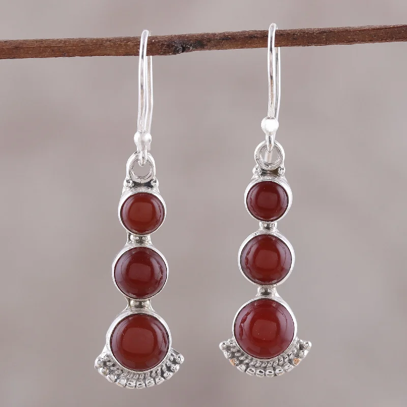 Best hoop earrings with asymmetrical designs for a fashion-forward, avant-garde look-Triple Gleam Round Carnelian and Sterling Silver Dangle Earrings